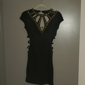 Little black dress with gold accent and cutouts